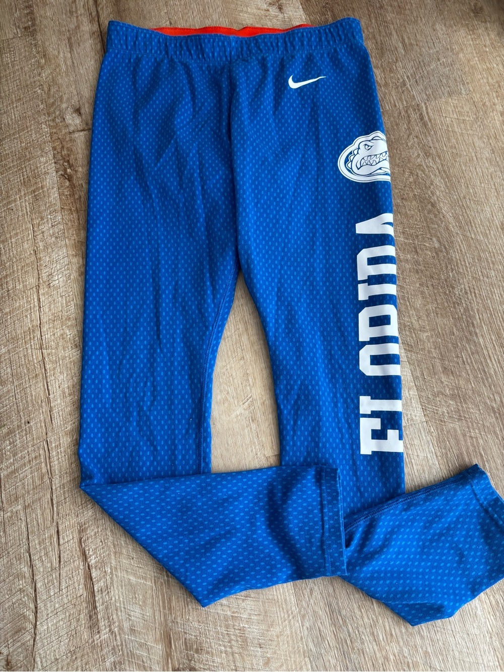 Nike Royal Blue Leggings with White Logos and Orange Waistband